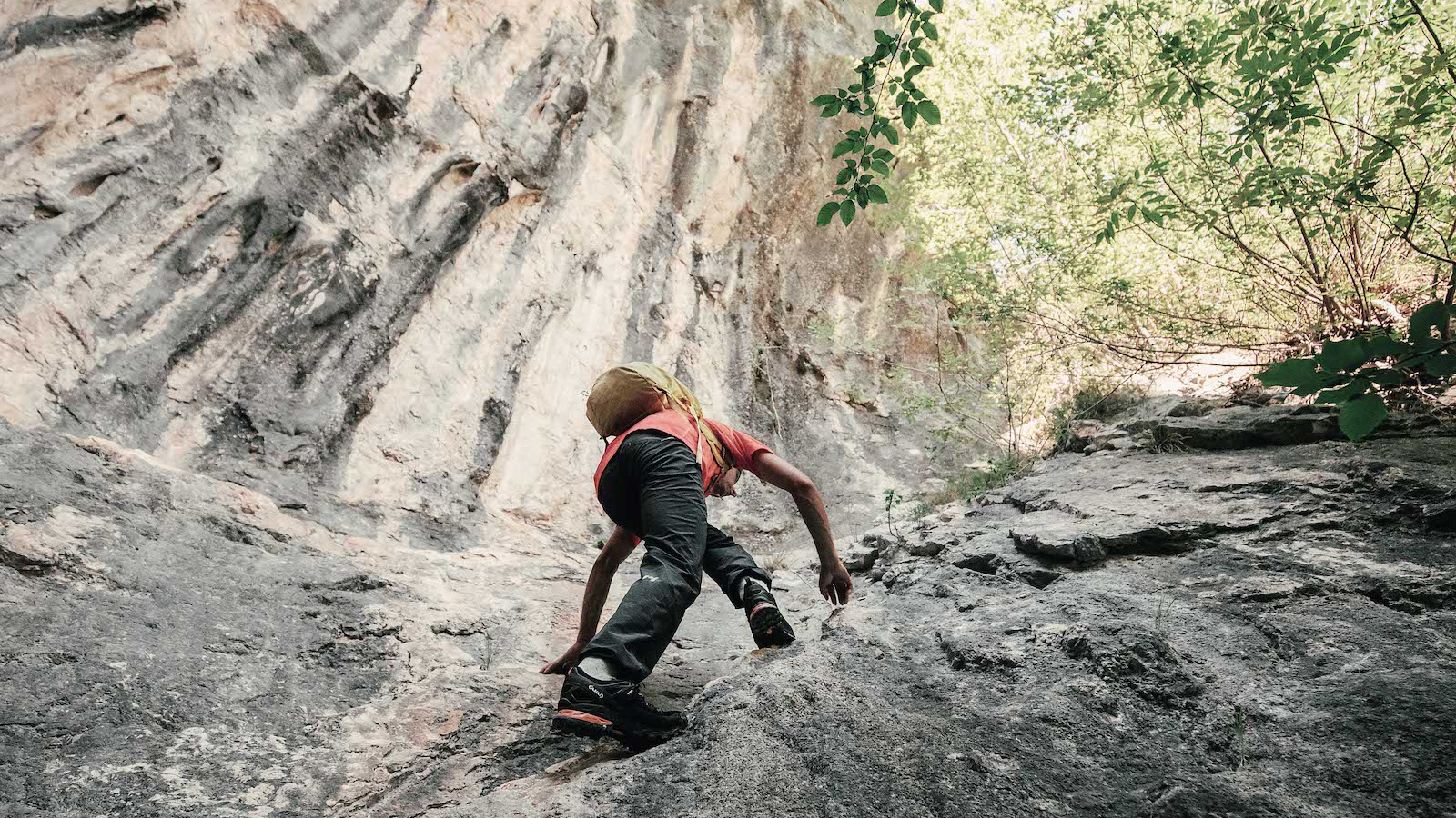 A climber ascending a steep, technical approach