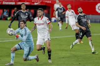 Real Madrid keeper Thibaut Courtois was called upon as Sevilla responded