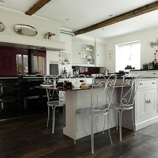 kitchen room with white walls and grey wooden flooring