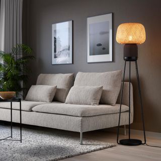IKEA x Sonos SYMFONISK floor lamp speaker beside sofa in living room