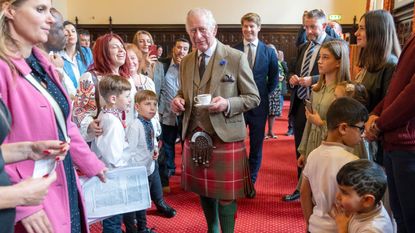 King Charles' red tartan kilt 