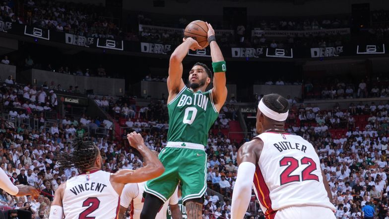 Jayson Tatum pulls up for a shot over Jimmy Butler and Max Strus