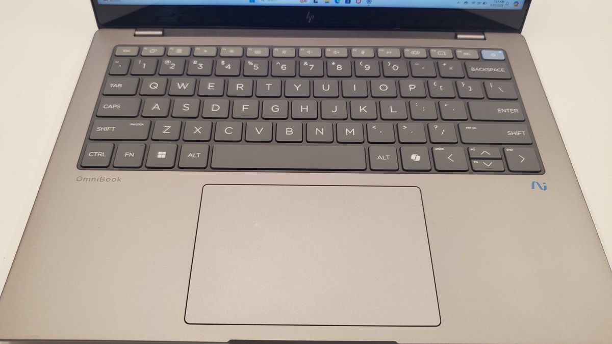 grey laptop on table
