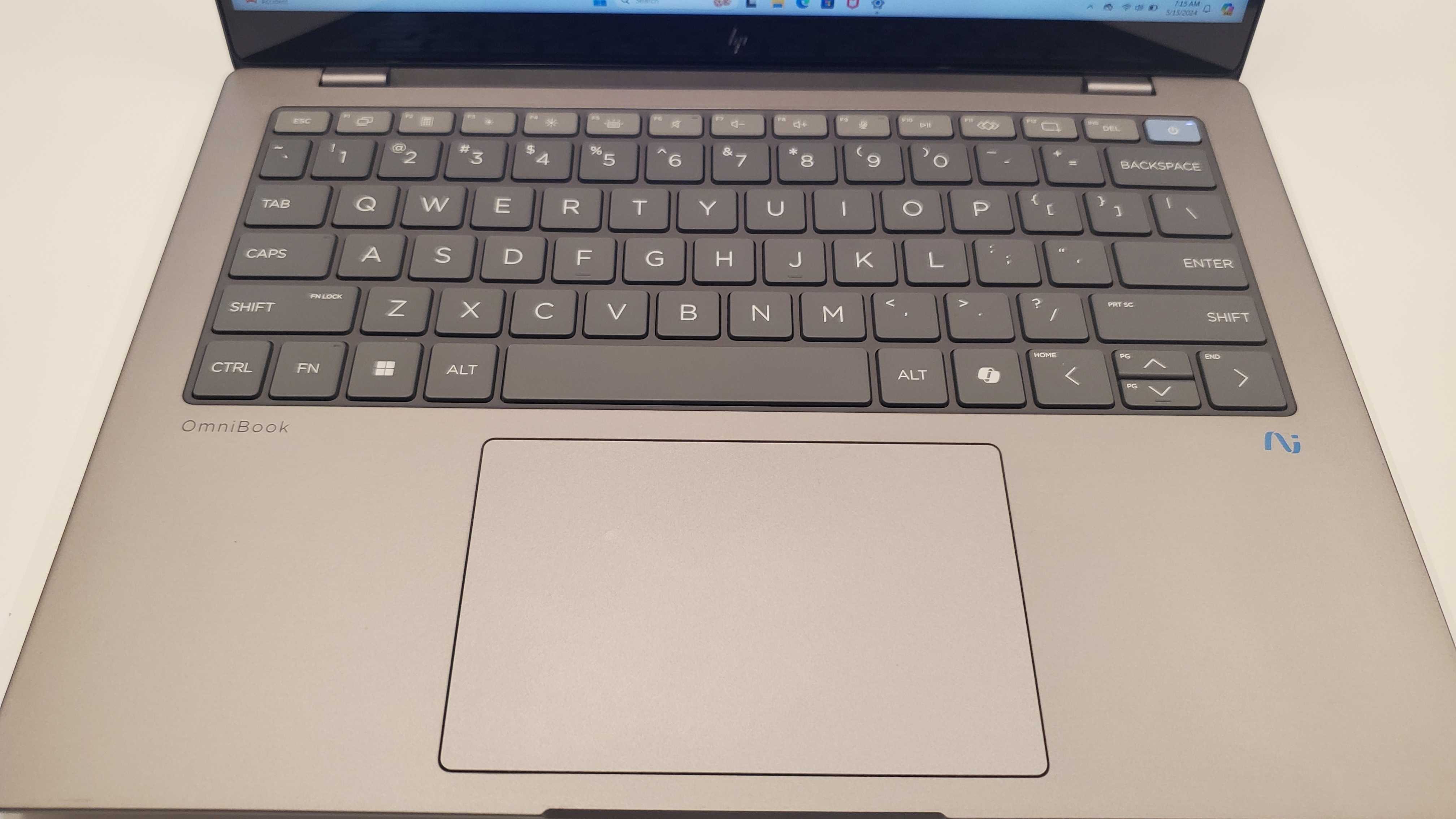 grey laptop on table