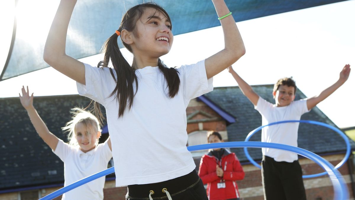 Children playing with hula hoops