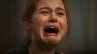 A close-up of Madelaine Petsch's face as Maya. Maya is crying and screaming with her mouth wide open in horror in the movie The Strangers: Chapter 1.