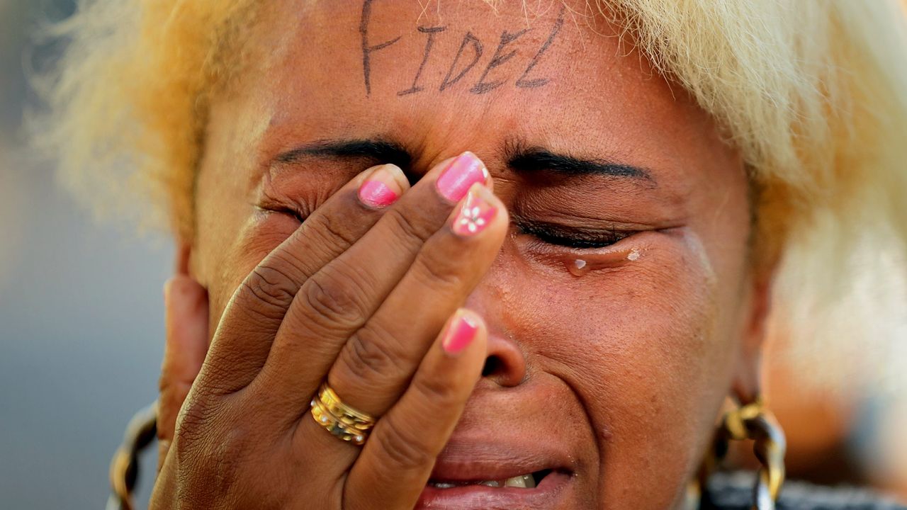 A Cuban woman cries as she pays her respects to revolutionary leader Fidel Castro, who died at the end of November