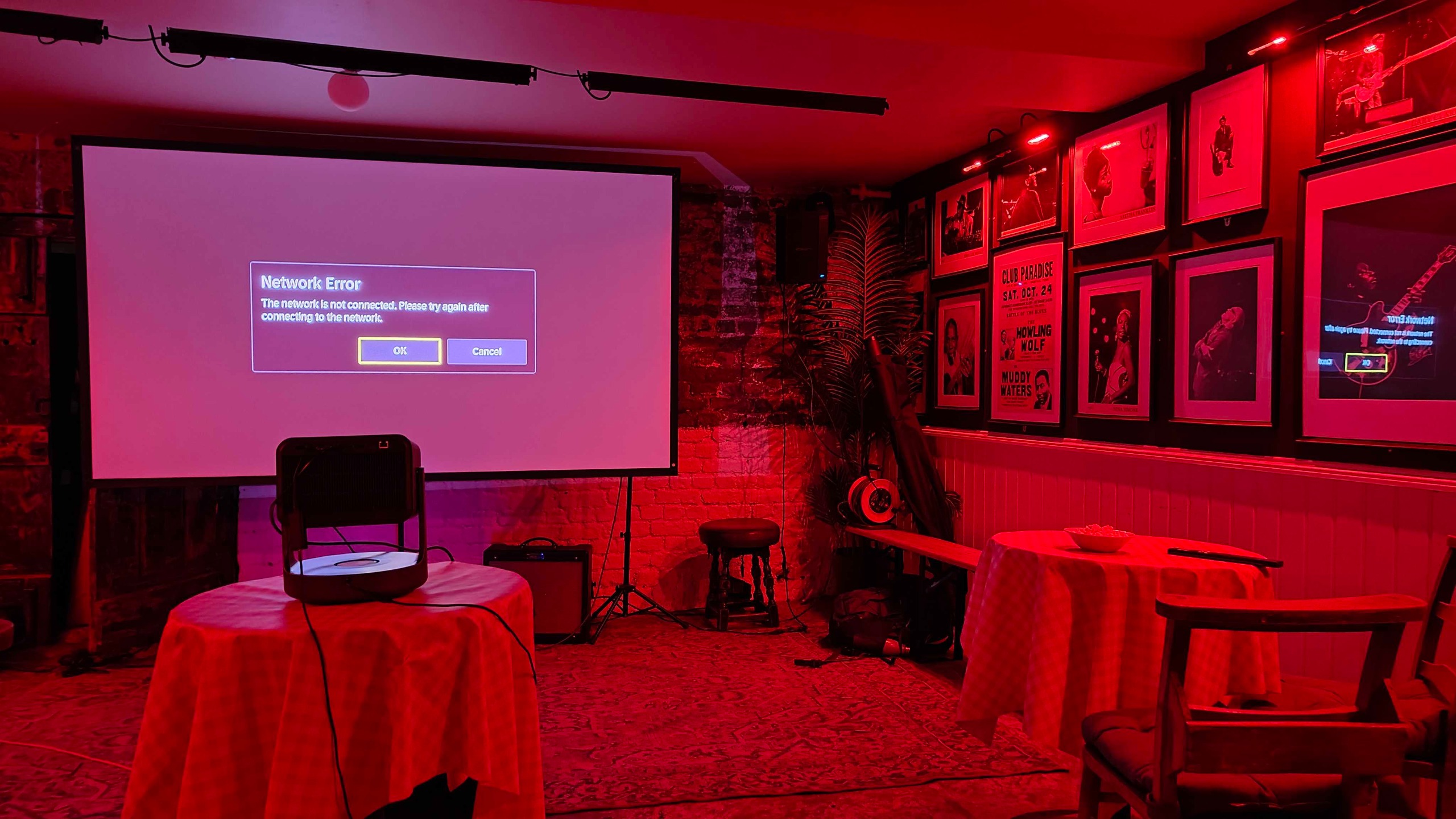 Hisense C2 Ultra projector on a table inside a pub