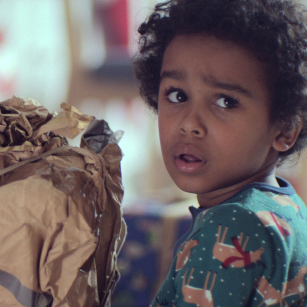 curly hair girl with paper bags