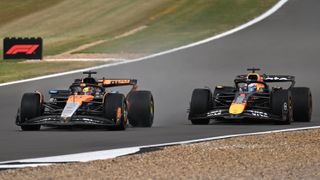 Oscar Piastri and Max Verstappen racing at Silverstone 