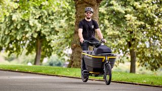 Dad ride a Raleigh electric cargo bike