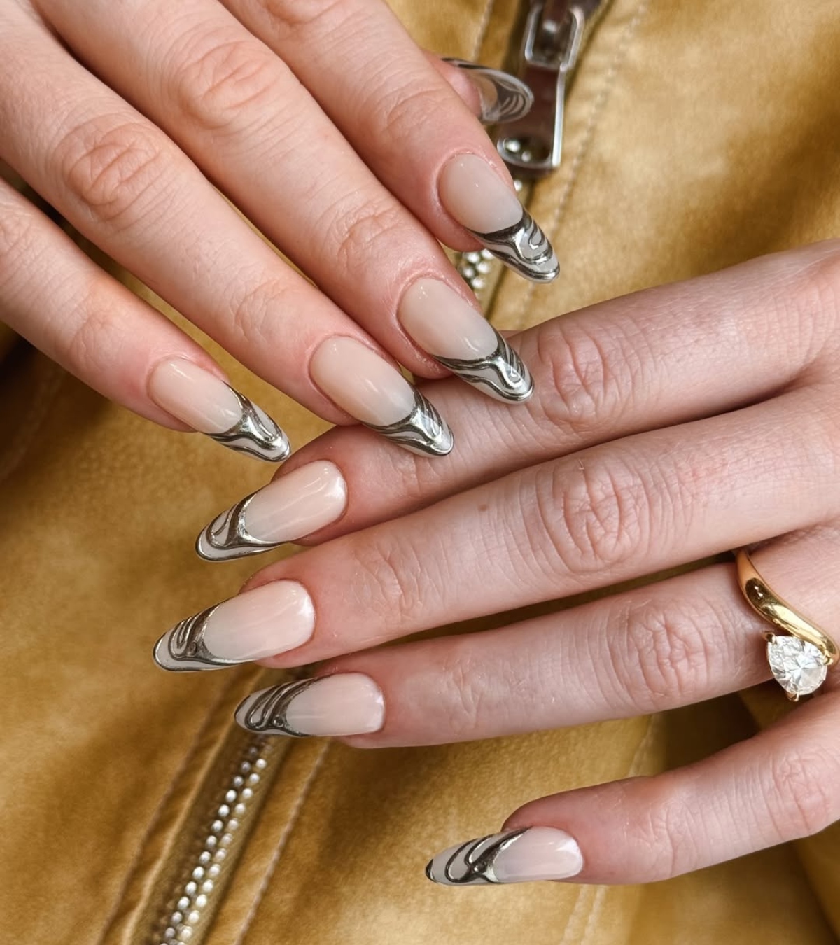 An abstract chrome manicure by Queenie Nguyen.