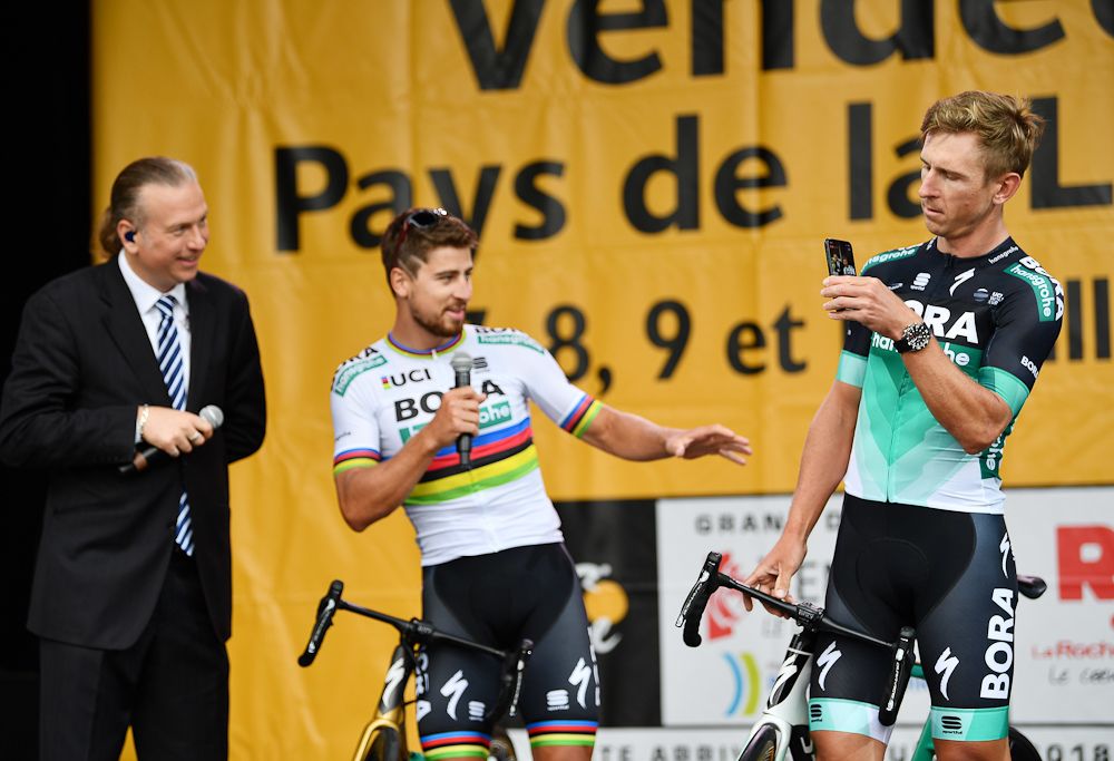 Peter Sagan and Maciej Bodnar have fun as Bora-Hansgrohe is presented Thursday at the 2018 Tour de France team presentation