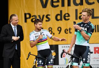 Peter Sagan and Maciej Bodnar have fun as Bora-Hansgrohe is presented Thursday at the 2018 Tour de France team presentation