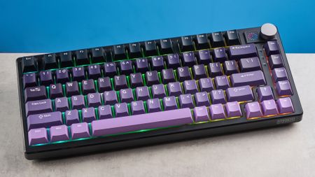 The Epomaker HE75 Mag on a stone surface with a blue background