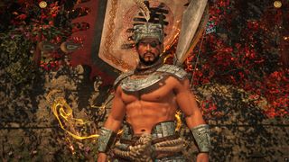 The player character, shirtless with armor only on their shoulders, stands in front of a banner in Wo Long 2: Wings of Ember