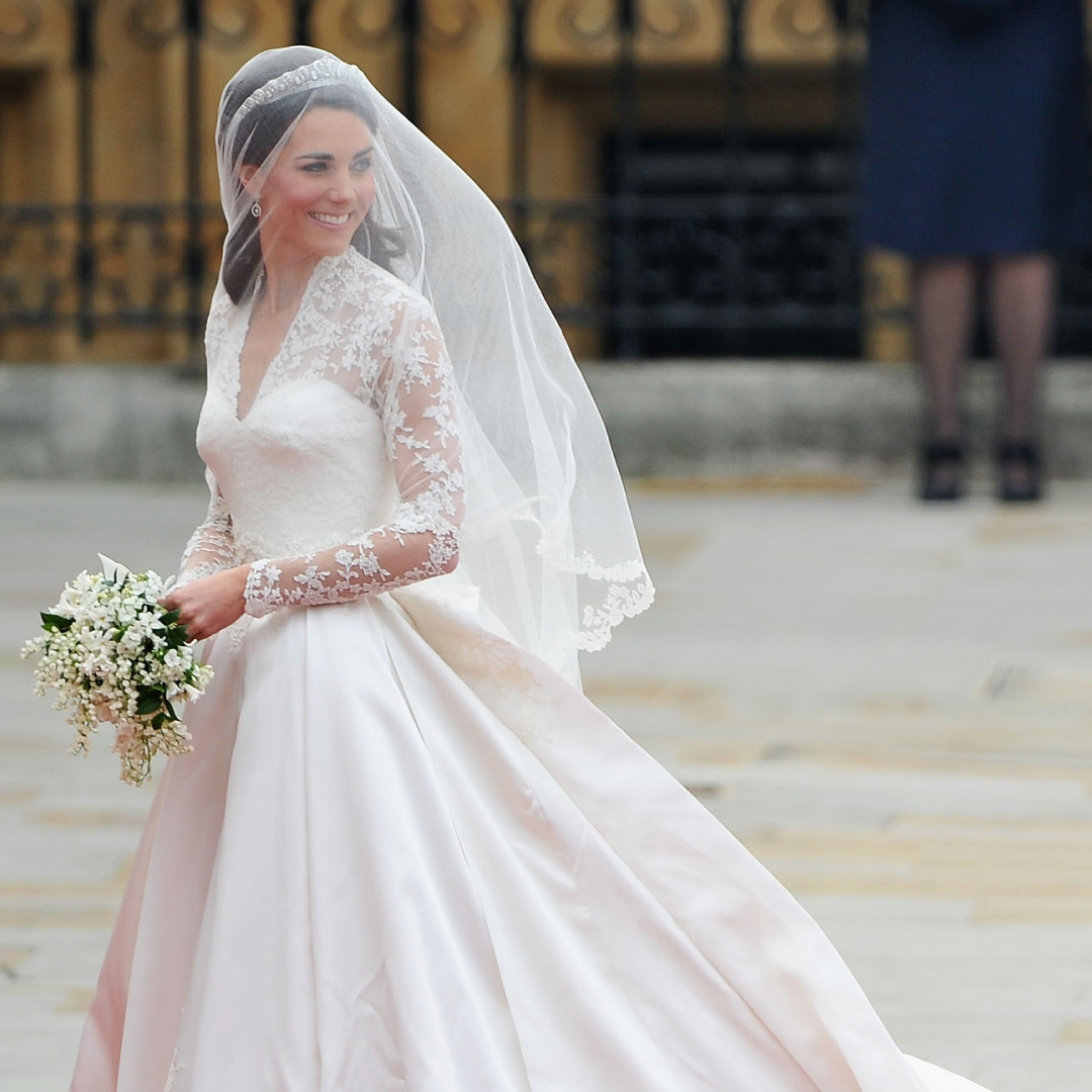 Princess Kate wearing her wedding gown and veil looking to the right