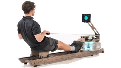 Man using WaterRower on white background