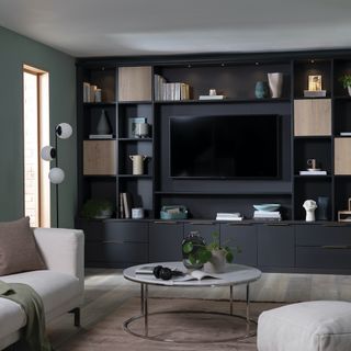 media cabinet with tv in and grey sofas