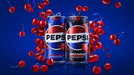 Promo shot showing two cans of Pepsi Wild Cherry surrounded by falling cherries