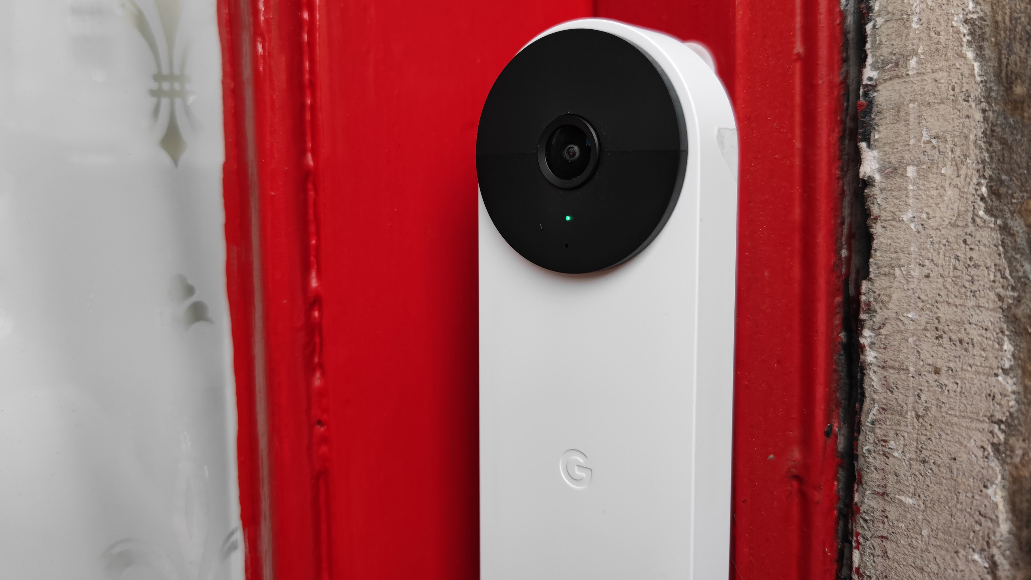 The Google Nest Doorbell (battery) connected to a door frame of a house