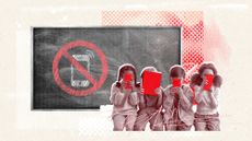 A row of children looking at their phones and tablets sitting in front of a chalkboard on which there is a drawing of a cell phone crossed out, indicating "no use allowed"