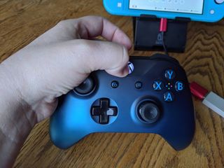 Hold down Home Button on Xbox One controller