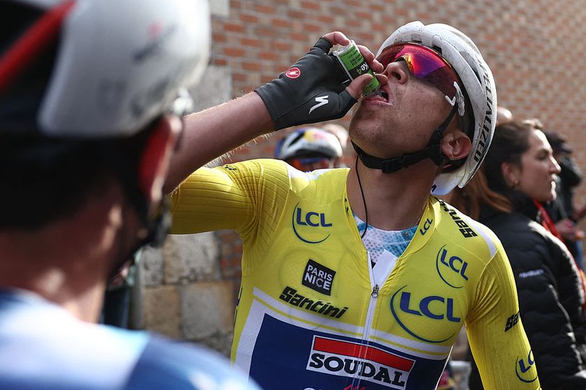Soudal Quick-Step&#039;s Belgian rider Tim Merlier wearing the overall leader&#039;s yellow jersey drinks from a bottle after wining the 2nd stage of the Paris-Nice cycling race, 183,9 km between Montesson and Bellegarde, on March 10, 2025. (Photo by Anne-Christine POUJOULAT / AFP)