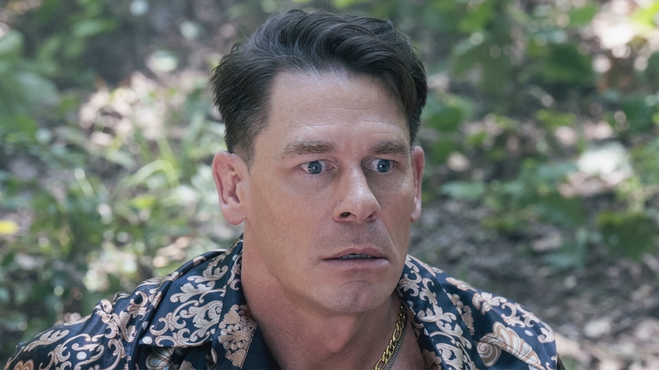 Chris sitting on ground looking stressed in Peacemaker Season 2