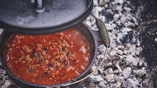 Chilli cooking in a camping dutch oven