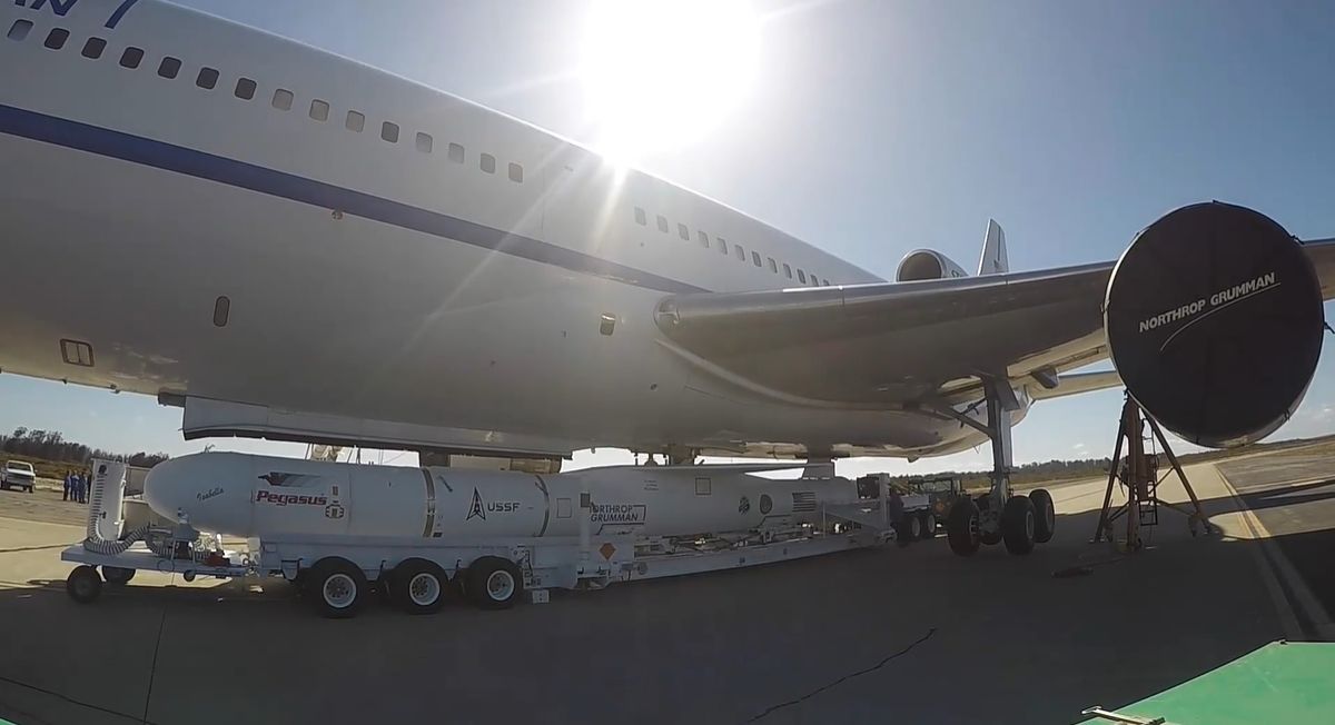 This still from a Vandenberg Space Force Base video shows a Northrop Grumman Pegasus XL rocket carrying the TacRL-2 satellite being loaded onto a Stargazer carrier plane for a June 13, 2021 launch.