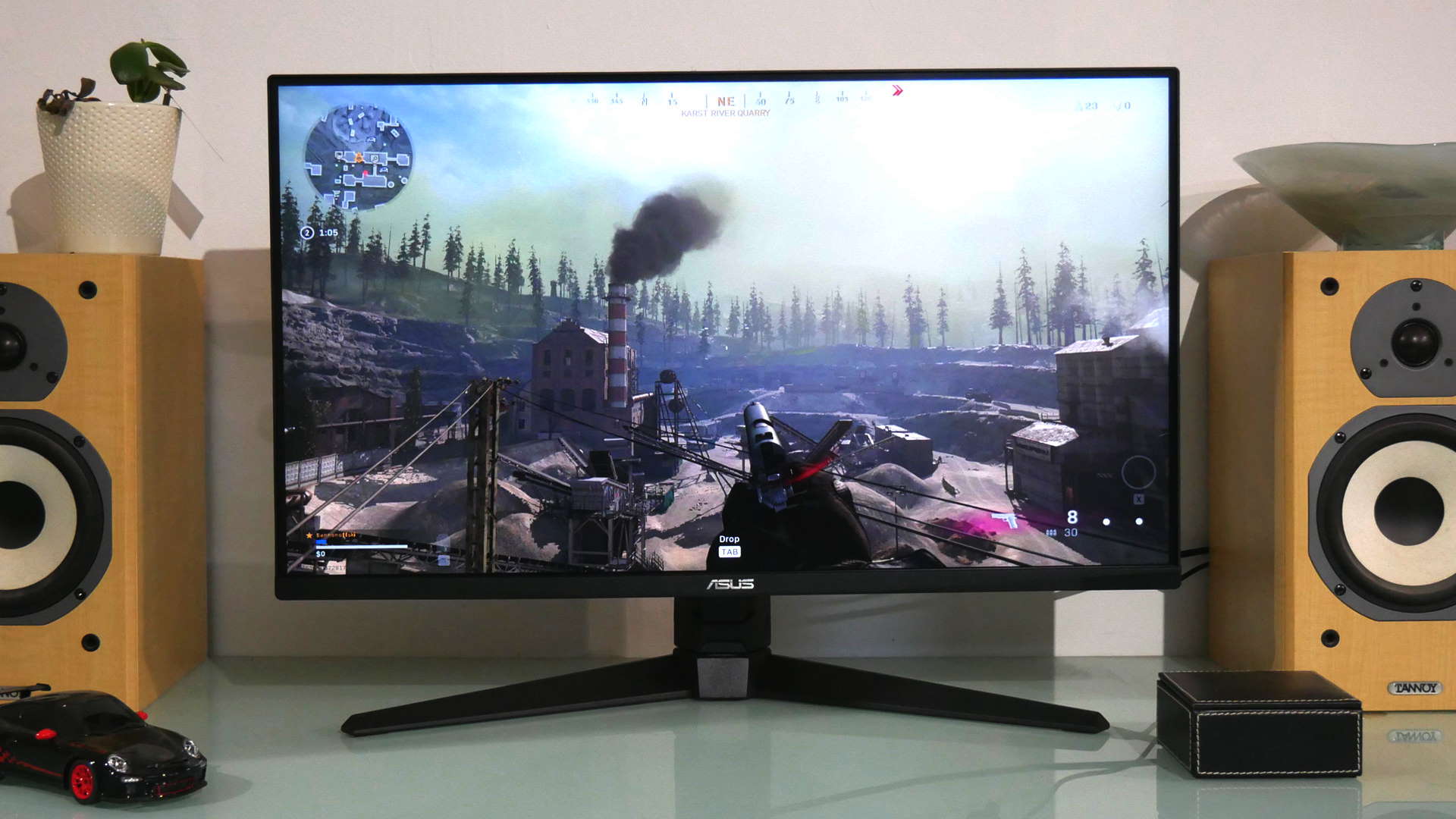 Asus TUF VG28UQL1A gaming monitor facing straight on with Call of Duty Warzone on the display