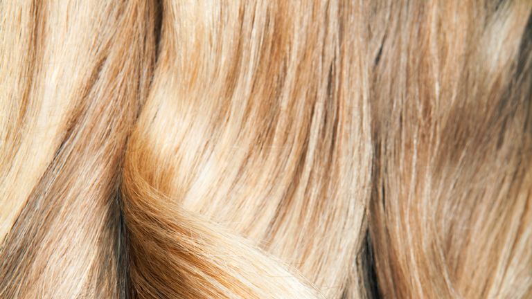 Close up shot of wavy, blond hair. - stock photo