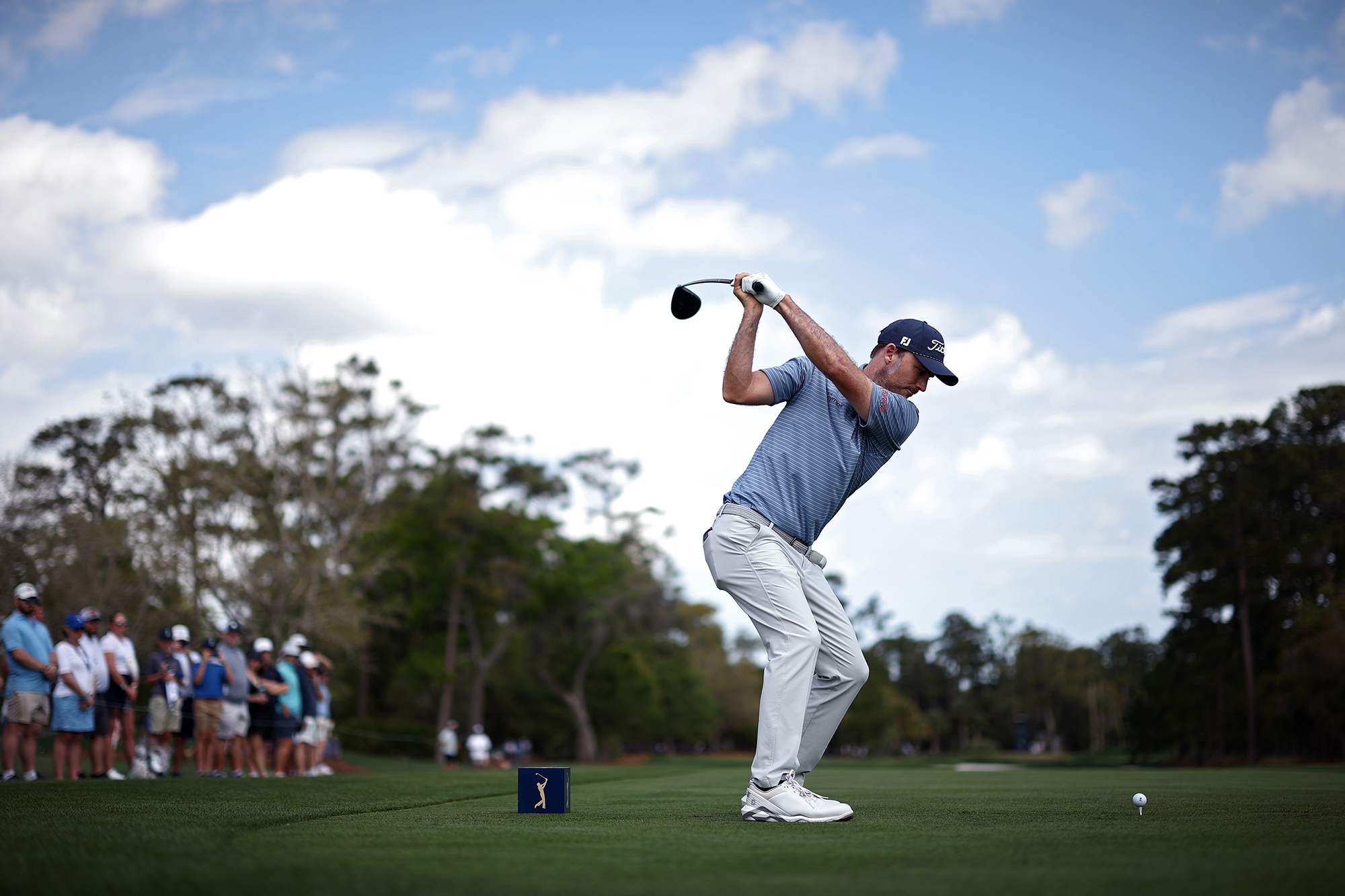 Russell Henley at the top of backswing with driver on the tee box