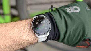 Garmin Forerunner 165 on wrist looking at post workout stats.