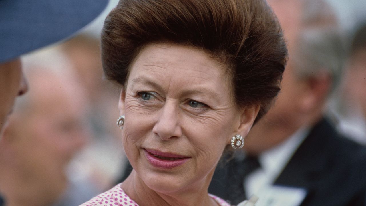 Princess Margaret&#039;s go-to dinner party game revealed. Seen here she visits the new Docklands development in London