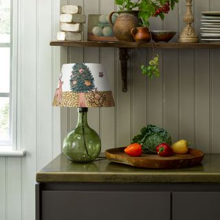cottage lighting ideas – woodland themed lamp illustrated by Maude Smith in a rustic cottage kitchen