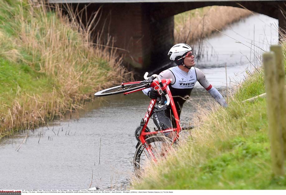 Gert Steegmans picks himself out of a canal after being blown off the road during Gent-Wevelgem