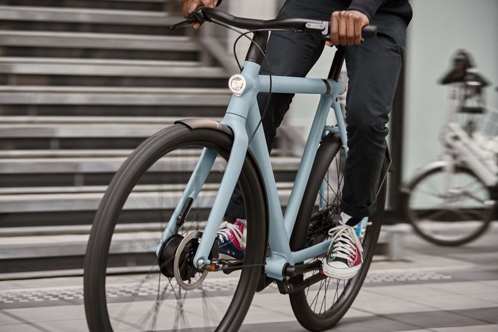 A person riding a VanMoof bike