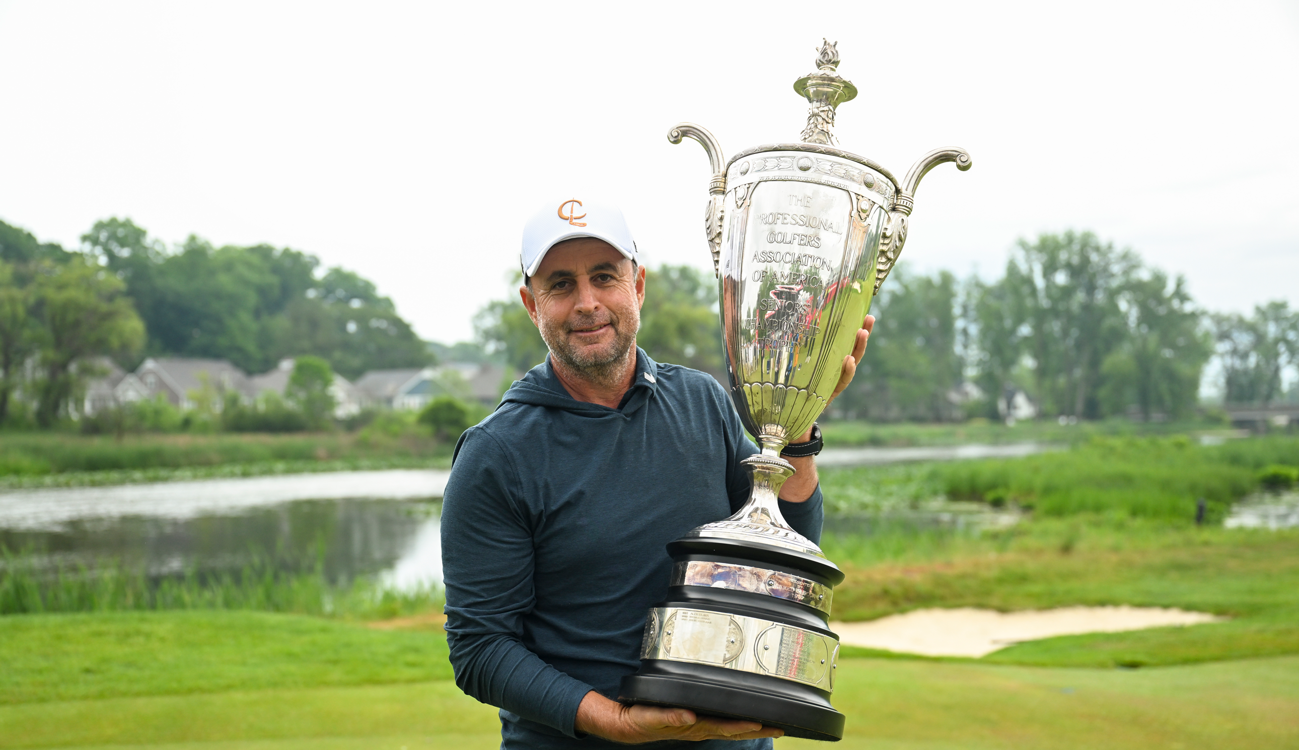 Richard Bland holds the Senior PGA Championship trophy