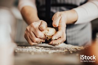 Woman kneading dough