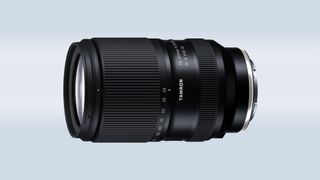 The Tamron 25-200mm f/2.8-5.6 Di III VXD G2 on a blue and gray background