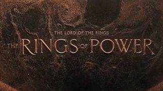 A sandy background with the words "The Lord of the Rings: The Rings of Power" over it.