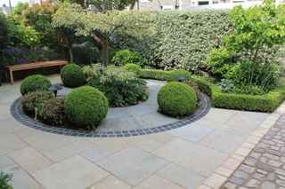 front garden with a circular paved design