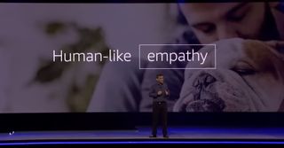 Amazon SVP Rohit Prasad speaking before a backdrop that reads "human-like empathy"