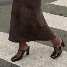 @_livmadeline wearing espresso brown heels with a pony hair skirt