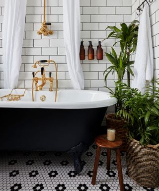 Black and white hexagon mosaic bathroom floor with subway tiles