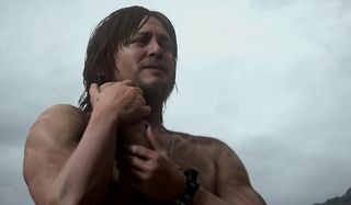 A soldier hugs a baby in Death Stranding