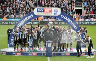 Newcastle celebrate with the Sky Bet Championship trophy after winning promotion back to the Premier League in 2017