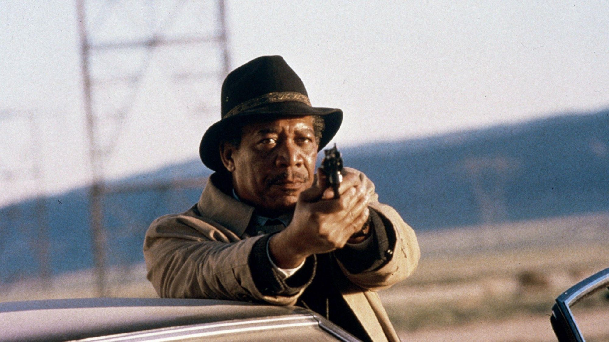 Morgan Freeman pointing a gun in Seven